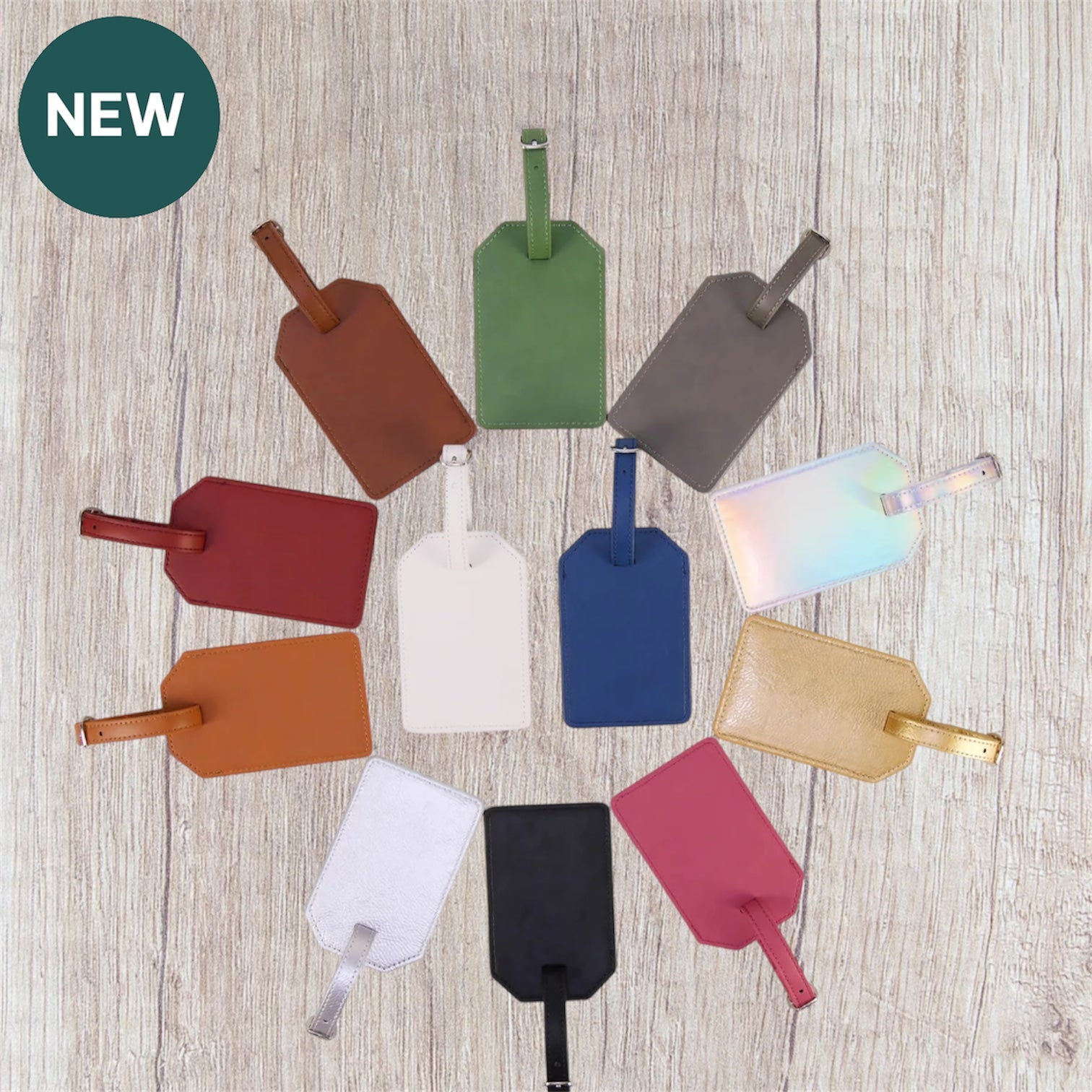 Colorful luggage tags arranged in a circular pattern on a wooden surface.