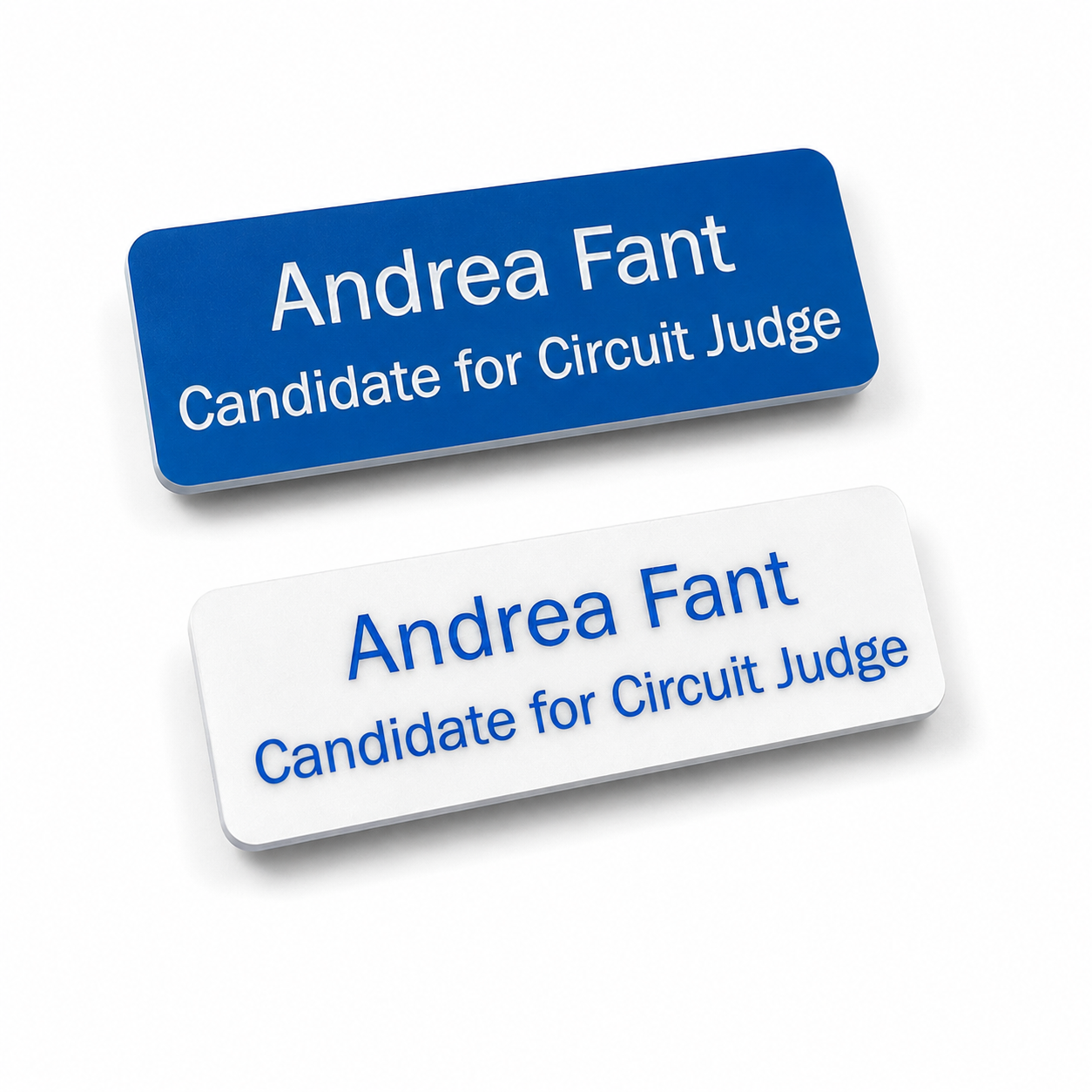 Two rectangular name tags on a white background, one blue with white text and one white with blue text.